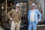 Two gentlemen wearing suits pose in front of the shop outside the Piccadilly Arcade in London. Participants for The Fourth Grand Flaneur Walk gathered in smart and fancy dresses by the statue of Beau Brummell on the Jermyn Street outside the Piccadilly Arcade. (Photo by Krisztian Elek \/ SOPA Images\/Sipa USA
