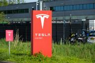 An American automotive and energy company that specialises in electric car manufacturing; Tesla, Inc. signboard seen in Tilburg, Netherlands. Tesla, Inc. has several factory buildings in the industrial zone of Vossenberg in Tilburg. Tilburg Factory & Delivery Center are close to the Wilhelmina Canal allowing for water-based delivery of intermodal. (Photo by Karol Serewis / SOPA Images/Sipa USA
