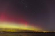 The Aurora Australis illuminates the sky from Brighton beach in Melbourne. (Photo by George Hitchens / SOPA Images/Sipa USA
