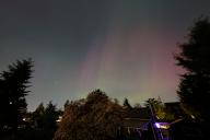 A rare glimpse of the aurora borealis over North Portland, Ore., on May 11, 2024, after the most extreme solar storm since 2003 struck Earth. (Photo by Alex Milan Tracy/Sipa USA