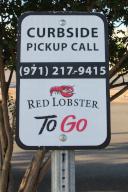 A curbside pickup sign at a Red Lobster restaurant at 1381 SW Interstate Highway Loop 410 in San Antonio, Texas, USA, on May 14, 2024. According to Neal Sherman, TAGeX Brands CEO, Red Lobster is closing at least 48 of its restaurants across 21 states. (Photo by Carlos Kosienski/Sipa USA