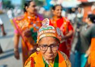 A Bharatiya Janata Party (BJP) supporter wearing a cap is seen on the street ahead of India