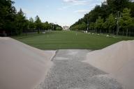 The anticipation for the UEFA Euro 2024 is building, and nowhere is this more evident than at the Brandenburg Gate in Berlin on May 16, 2024. In an unprecedented transformation, a vast artificial lawn has been laid out on the iconic Straße des 17. Juni, creating a green oasis where thousands of cars usually pass. The fan zone, set to host one of the largest football parties ever, spans approximately 24,000 square meters and features polypropylene artificial grass. This ambitious project, costing around 1.2 million euros, aims to provide a vibrant and comfortable space for football enthusiasts to gather and celebrate the tournament. Berlin expects to welcome up to 2.5 million fans from June to July. The Brandenburg Gate will be symbolically turned into the world