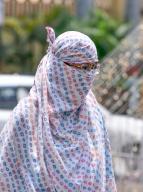 Varanasi, May 12, 2024 (ANI): A girl covers her face with a scarf to protect her from scorching heat during a hot summer afternoon, in Varanasi on Sunday. (ANI Photo via Hindustan Times/Sipa USA/Rahul Singh