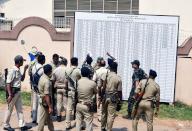 Ranchi, May 12, 2024 (ANI): Police force watch the list of duty shifts for the fourth phase of Lok Sabha polls , in Ranchi on Sunday. (ANI Photo via Hindustan Times/Sipa USA