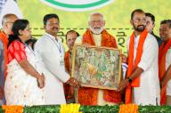 Howrah, May 12, 2024 (ANI): Prime Minister Narendra Modi being felicitated by the Bharatiya Janata Party (BJP) leaders during a public meeting in support of the party candidate from Howrah constituency Rathin Chakraborty for the Lok Sabha polls, in Howrah on Sunday. (ANI Photo via Hindustan Times/Sipa USA