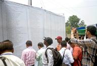 Asansol, May 12, 2024 (ANI): Polling officials check the list of the polling booths on the eve of the fourth phase of the Lok Sabha polls, in Asansol on Sunday. (ANI Photo via Hindustan Times\/Sipa USA