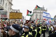 Pro-Palestinian supporters hold placards during the demonstration. This is the ongoing series of protests by both pro-Israeli and pro-Palestinians supporters in London since the start of the Israel-Gaza War in Oct 2023. (Photo by Hesther Ng \/ SOPA Images\/Sipa USA