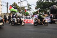 Pro-Palestine protesters walk a long march to commemorate the 76th anniversary of the Nakba in Bandung, West Java, Indonesia, on May 19, 2024. Pro-Palestine protesters who are members of Bandung Solidarity For Palestine also spoke out to stop the genocide committed by Israel against Palestinians in Gaza and Rafah. (Photo by Dimas Rachmatsyah/Sipa USA