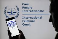 The International Court of Justice (ICJ) logol is displayed on a smartphone with ICJ visible in the background in this photo illustration. Taken in Brussels, Belgium. On May 20, 2024. (Jonathan Raa / Sipa USA) *** Strictly for editorial news purposes only 