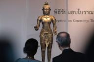 People seen looking at a 900 years old bronze statue of the Hindu god Shiva also known as "Golden Boy" during a repatriation ceremony at the National Museum of Thailand. 2 of the ancient bronze statues, a 900 years old statues of the Hindu god Shiva also known as "Golden Boy" and "Kneeling Female", have been returned from the United States to Thailand after illegal smuggled out of Thailand in 1975. (Photo by Peerapon Boonyakiat \/ SOPA Image\/Sipa USA