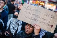 A demonstrator seen holding a placard that says "from Sudan to Palestine may we experience freedom and libration in our lifetime" during the rally. Palestinian supporters protesting against Israel