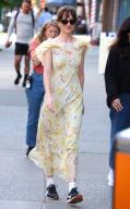 Actress Dakota Johnson walks with a nice yellow dress on set of "The Materialists" in The West Village, NY on May 31, 2024. Photo by SIPA