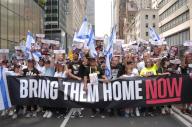 During the 59th annual Israel Day Parade, parade participants hold placards and a banner demanding the release of hostages taken by Hamas during the October 7, 2023 Hamas attack in Israel. The Israel Day Parade commemorating Jewish culture, draws revelers, floats and Israeli-American organizations to midtown Manhattan, New York City. The parade took place nearly eight months after the start of the Israel-Hamas war. This year