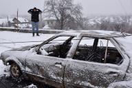 A local resident stands by the destroyed car following Russian shelling in Zaporizhzhia. Russia unleashes a further wave of missile and drone strikes across several regions in Ukraine Monday (January 8) with 45 people injured and 4 people have been reported dead. The situation on the front line remained relatively stable, according to Ukrainian President Volodymyr Zelenskyy. (Photo by Andriy Andriyenko / SOPA Images/Sipa USA