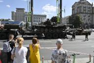 People look at the destroyed battle tank of the Russian army at the Independence Square in the center of Kyiv. Ukrainians will celebrate the 32th anniversary of Independence Day on August 24, 2023 (Photo by Sergei Chuzavkov / SOPA Images/Sipa USA