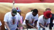 Competitive eaters participate in Nathans Famous Hot Dog Eating Qualifier in Times Square in New York, NY on May 17, 2024. (Video by Efren Landaos/Sipa USA)                    