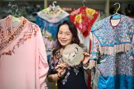 Ms Cai Bi Xia, 51, Chinese opera practitioner, founder and artistic director of Traditional Arts Centre (Singapore), posing with some of her costumes, 29 March 2024. She is one of three recipients of the National Heritage Boardâs (NHB) Stewards of 