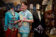 Peranakan (Straits Chinese) beadwork and embroidery practitioner Raymond Wong with some of his kebaya (traditional clothing) and beaded shoes, 28 March 2024. Mr Wong is one of three recipients of the National Heritage Board