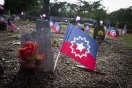 Juneteenth flags were placed early Monday by an anonymous donor to decorate graves of slaves buried in the Marietta City Cemetery, with all but four unmarked. It is the only slave burial ground in any major white Georgia cemetery, and contains 