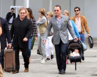 Sir Elton John and David Furnish with their son Zachary are spotted arriving at Marco Polo Airport in Venice.. .Pictured: Elton John, David Furnish and Zachary. . Ref: SPL281128 010611 .Picture by: Maurizio La Pira / Splash News . . ...