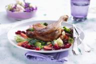 Duck leg on savoy cabbage with cranberries