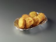 Deep-fried slices of banana in a cardboard tray