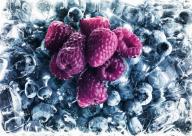Raspberries on frozen blueberries