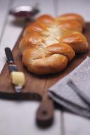 Plaited loaf on a wooden board