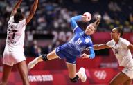 TOKYO, JAPAN - AUGUST 8, 2021: Players Polina Vedekhina (C) of ROC, Estelle Nze Minko (L) and Beatrice Edwige of France struggle in the womenâs final handball match between ROC and France at the Yoyogi National Gymnasium as part of the 2020 Summer 