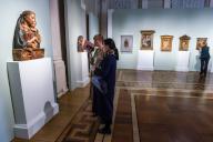 ST PETERSBURG, RUSSIA - MARCH 30, 2022: Women visit an exhibition titled "Florence Sculpture in the 15th Century" and held at the State Hermitage Museum. The exhibition features 25 works made of terracotta, gypsum, majolica and wood, with several 
