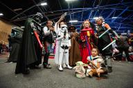 Star Wars fans pose for a photo wearing movie related costumes during the 2022 edition of the SOFA (Salon del Ocio y la Fantasia) in Bogota, Colombia, through October 14 to 18