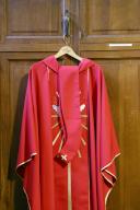 Saint Nicolas church. Sacristy. Red chasuble for priest. Cluses. France