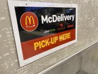 McDelivery sign, Pick up area for UberEATS, DoorDash and Grubhub, McDonalds fast food restaurant, Queens, New York