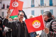 Tunisian General Labor Union Noureddine Taboubi addresses to people as they take part in International Workers