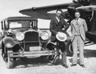 California: 1928 Howard Hughes and stunt flyer Roscoe Turner at an airport in California. Hughes is driving the official car of the Pacific Aero Club.
