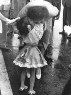 Caracas, Venezuela: November 16, 1961 Mrs. Jacqueline Kennedy gives five year old Maria Gianetta a kiss after the little girl presented her with an orchid upon her arrival at the airport here.