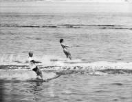 Hyannis Port, Massachusetts: July 22, 1962 Jacqueline Kennedy and astronaut John Glenn water ski on Lewis Bay. The boat was driven by Ethel Kennedy, wife of the Attorney General.