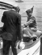 Hyannis Port, Massachusetts: July 8, 1961 President Kennedy steps into the cockpit of the yacht, 