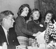 Charleston, West Virginia: September 19, 1960 A smiling Senator John F. Kennedy listens to the Bloomfield sisters sing the West Virginia Democratic campaign song duirng his appearance in Charleston.