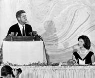 Washington, D.C.: September 20, 1960 Senator John F. Kennedy as he spoke tonight at a $100-a-plate fund raising dinner. His wife, Jacqueline, watches the Democratic presidential nominee as he outlines his plan to preserve and further U.S. world ...