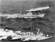 Cuba: 1962 The Soviet freighter Anosov, rear, being escorted by a Navy plane and the destroyer USS Barry, while it leaves Cuba probably loaded with missiles under the canvas cover seen on deck