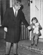 Washington, D.C.: November 26, 1960 President-elect John F.Kennedy takes his daughter Caroline by the hand as they leave home. She will be three tomorrow.