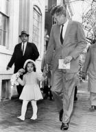Washington, D.C.: November 27, 1960 President-elect Kennedy walks with his daughter Caroline on their way to church services on her third birthday. Afterwards Kennedy went to Georgetown Hospital to visit his wife and their new-born son.