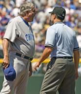 Chicago Cubs manager Lou Piniella argues the call on the second inning ending double play call against the Colorado Rockies at Coors Field in Denver on August 9 2009. Umpire Angel Campos keeps Piniella from approaching second base umpire Chris ...