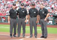 Major League Umpires ( L to R) Dan Iassogna, Alex MacKay, C.B. Bucknor and Ben May pose for a photograph at home plate before a game between the Chicago White Sox and the St. Louis Cardinals at Busch Stadium in St. Louis on Friday, May 3, 2024. Photo by Bill Greenblatt