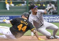 Pittsburgh Pirates first base Rowdy Tellez (44) is safe at second ahead of the tag from Colorado Rockies second base Alan Trejo (13) with a double in the sixth inning against the Colorado Rockies at PNC Park on Sunday May 5, 2024 in Pittsburgh. Photo by Archie Carpenter