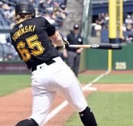 Pittsburgh Pirates outfielder Jack Suwinski (65) singles to left scoring one run in the sixth inning against the Colorado Rockies at PNC Park on Sunday May 5, 2024 in Pittsburgh. Photo by Archie Carpenter