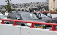 People stand still beside their stopped cars in Jerusalem, during a two-minute siren in remembrance of the six million Jews murdered by Nazi Germany in World War II on Israel\'s annual Holocaust Remembrance Day, on Monday, May 6, 2024. Israel comes to a stop as the siren sounds across the country to commemorate Jews who perished during World War II. Photo by Debbie Hill