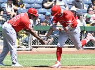 Los Angeles Angels outfielder Jo Adell (7) celebrates his solo homer with Los Angeles Angels third base coach Eric Young Sr. (85) in the third inning against the Pittsburgh Pirates at PNC Park on Wednesday May 8, 2024 in Pittsburgh. Photo by Archie Carpenter
